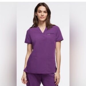 Jaanuu Relaxed 3 Pocket Scrub Top in limited edition Eggplant color